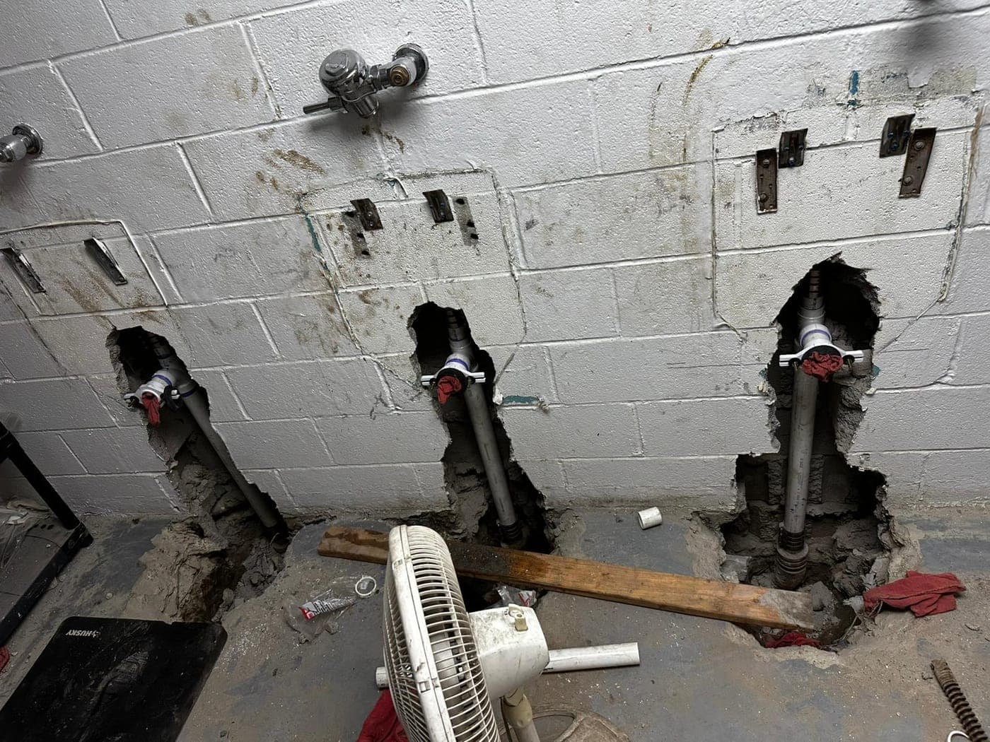 Basement mechanical room with a furnace and water heater serviced by Master's Plumbing