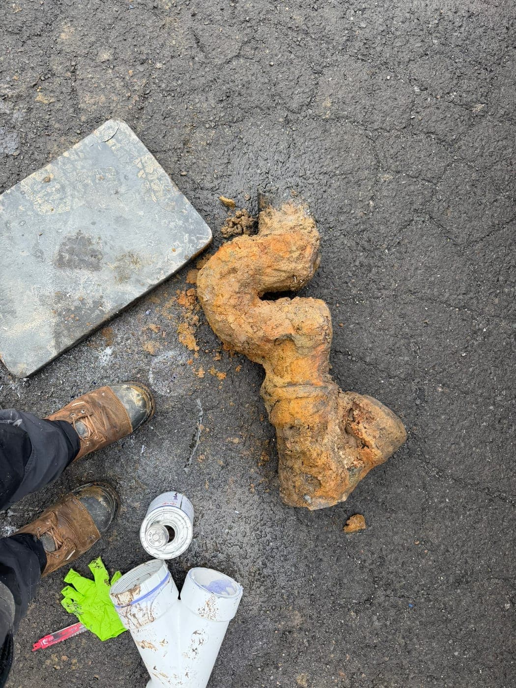 Corroded cast iron sewer fitting removed from a home