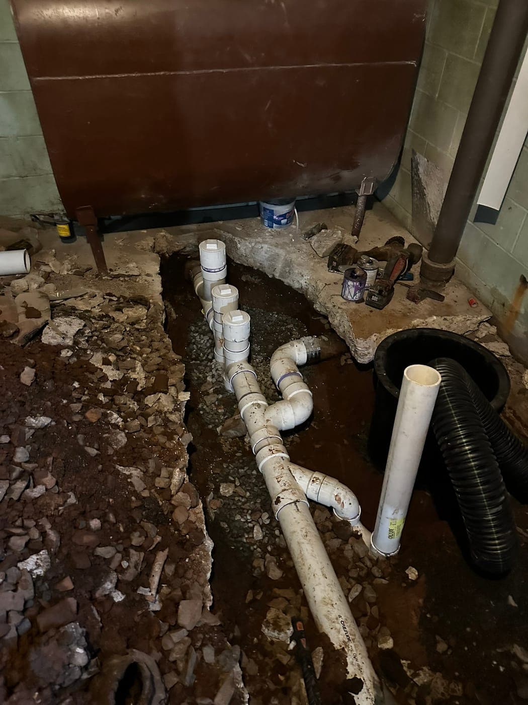New sewer connections and cleanout in a basement