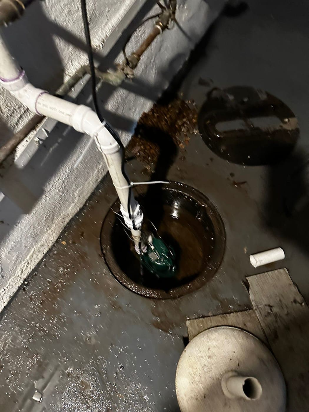 Sump pump installed in a basement pit