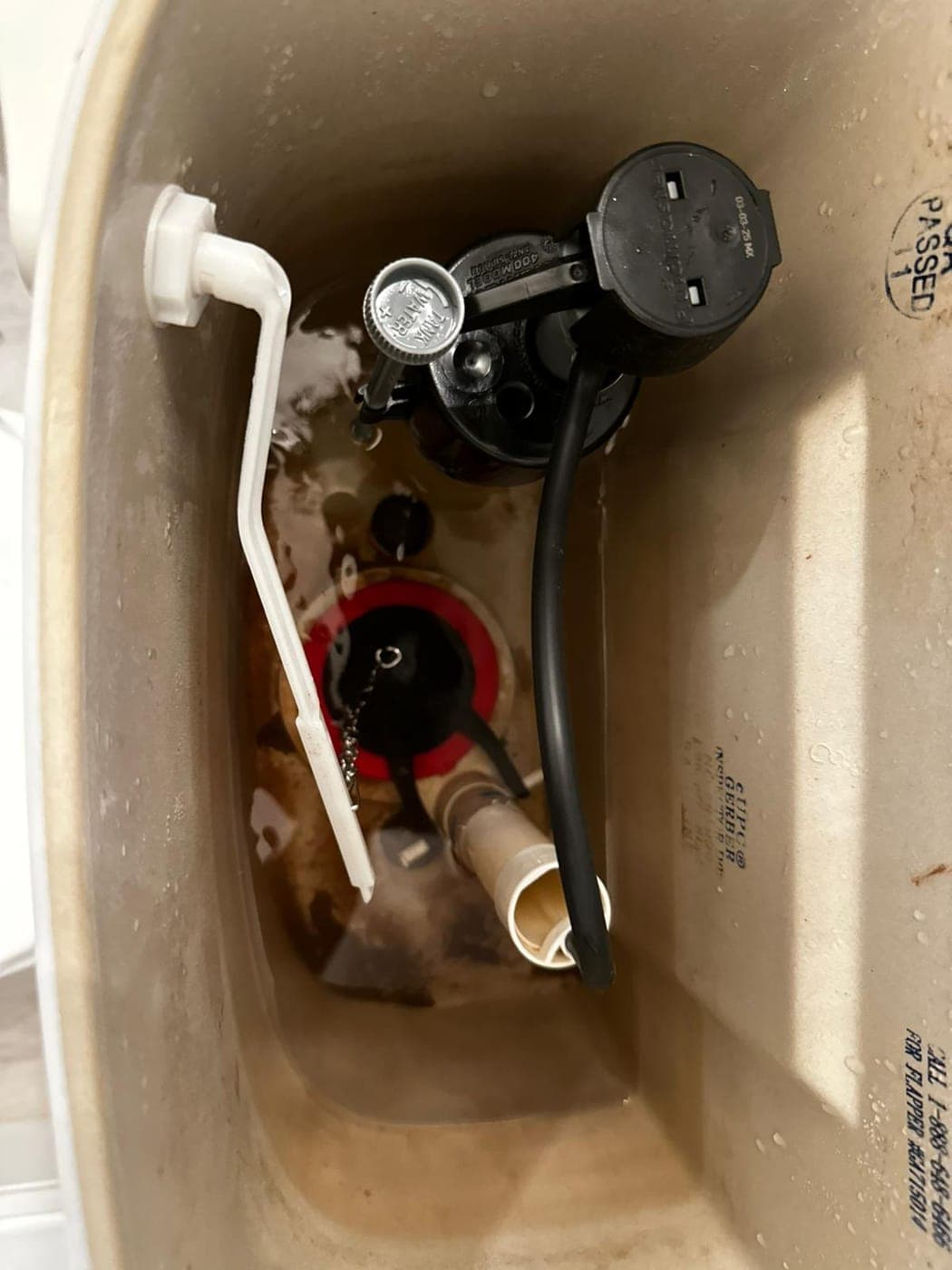 Toilet tank fill valve and flapper replaced during a repair in a North Jersey bathroom
