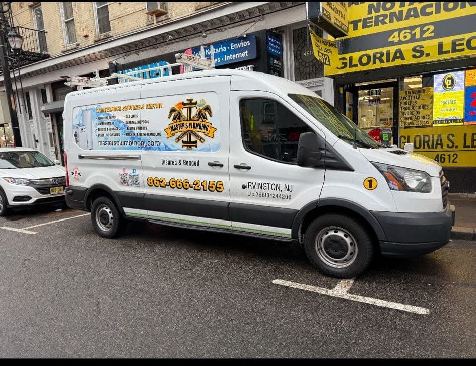 Master's Plumbing marked service van parked on a busy North Jersey street