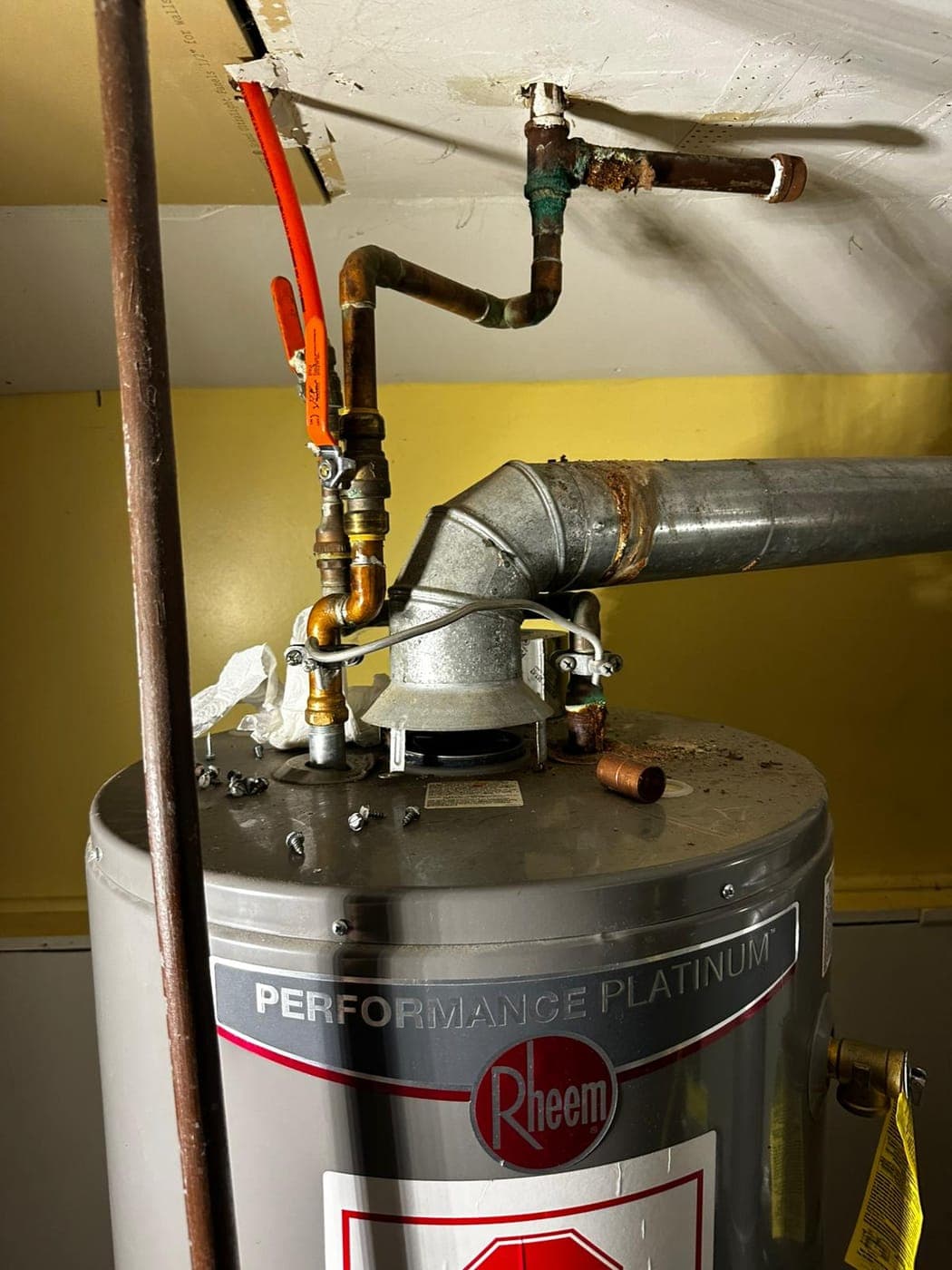 Water heater flue and copper piping