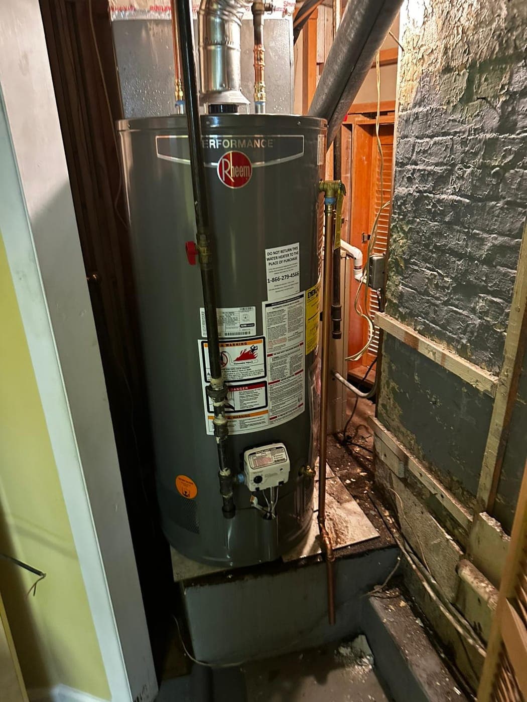 Newly installed gas tank water heater in a North Jersey basement